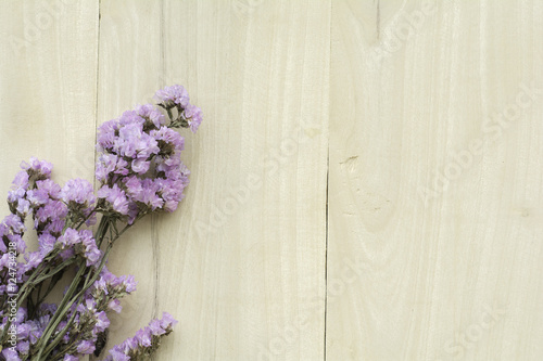 Statin Dry flowers on wooden background.