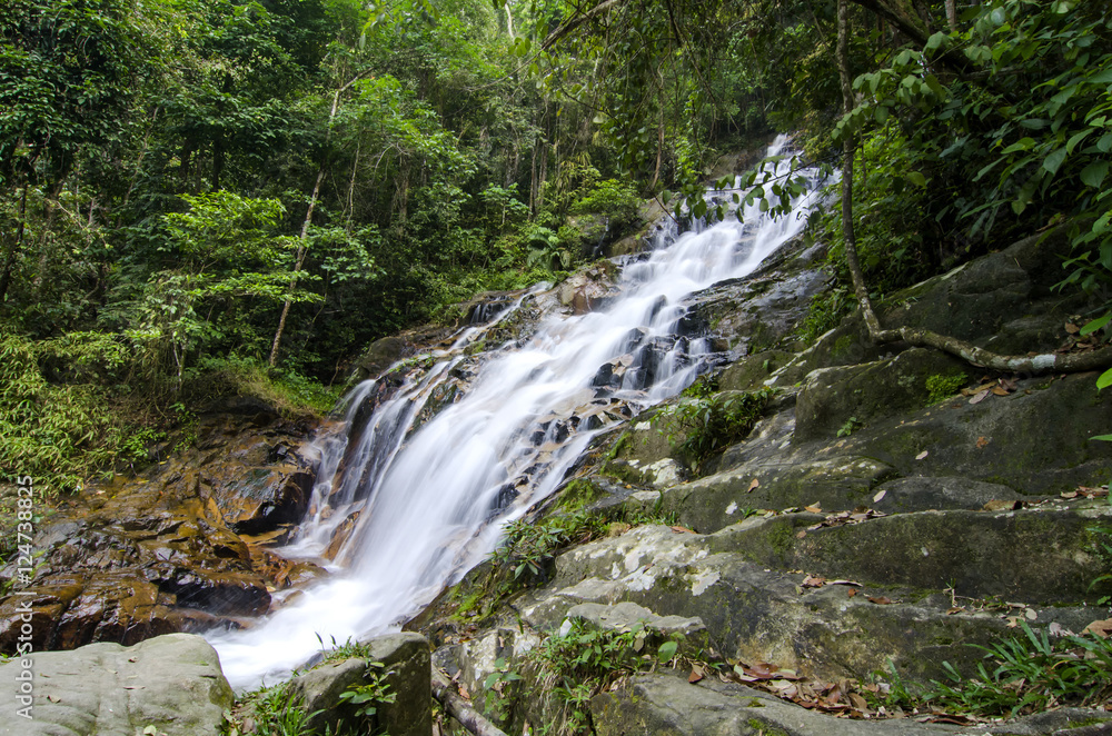 beautiful in nature, amazing cascading tropical waterfall. wet a beautiful in nature, amazing cascading tropical waterfall. wet a