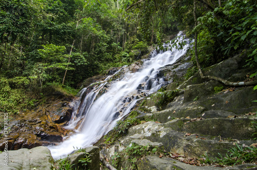 beautiful in nature, amazing cascading tropical waterfall. wet a