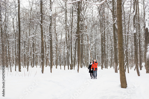 people, season, love and leisure concept - happy couple outdoors in winter.