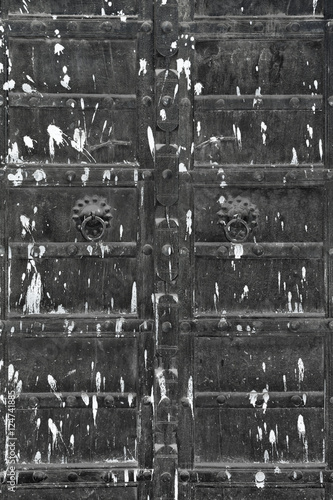 Paint-splattered black wooden door  Pushkar  Rajasthan  India
