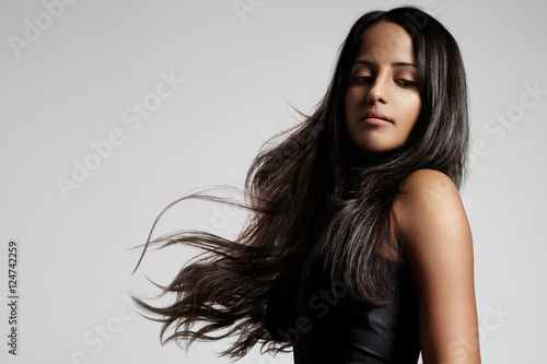 woman with healthy brunette hair in studio shoot