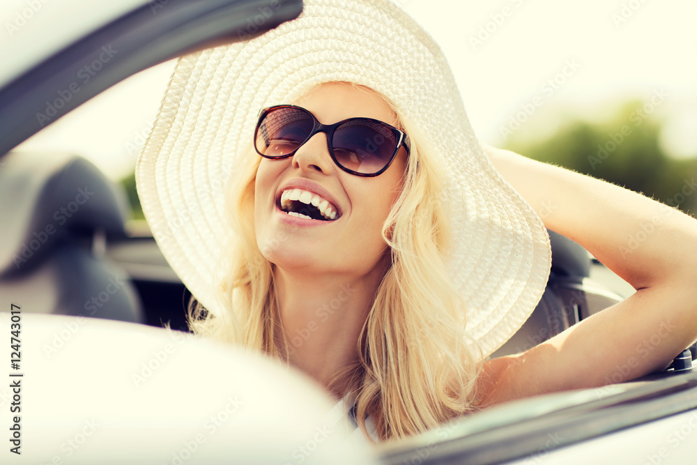 happy woman driving in cabriolet car