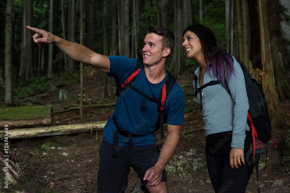Hiker couple pointing at distance Hiker couple pointing at distance