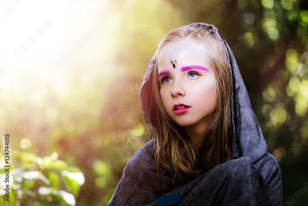 Girl with fantasy make up in woods. Girl with fantasy make up in woods.