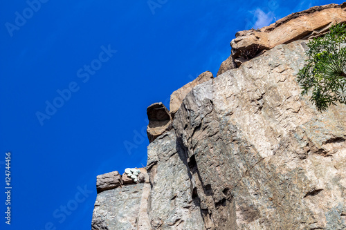 Up view photo of steep rock cliff photo