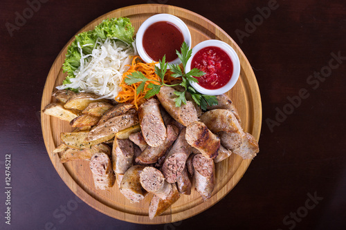Assorted sausages with sauce