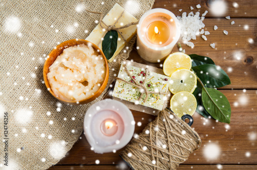 natural soap and candles on wood