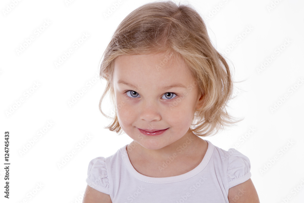 Adorable little girl looking at the camera close-up Adorable little girl looking at the camera close-up