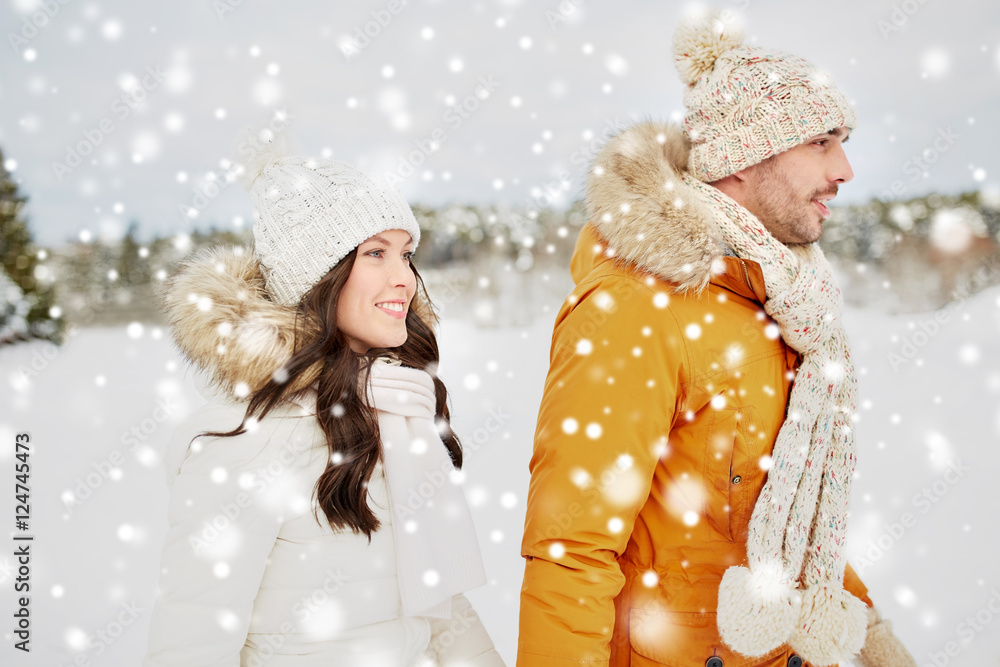 happy couple walking over winter background happy couple walking over winter background
