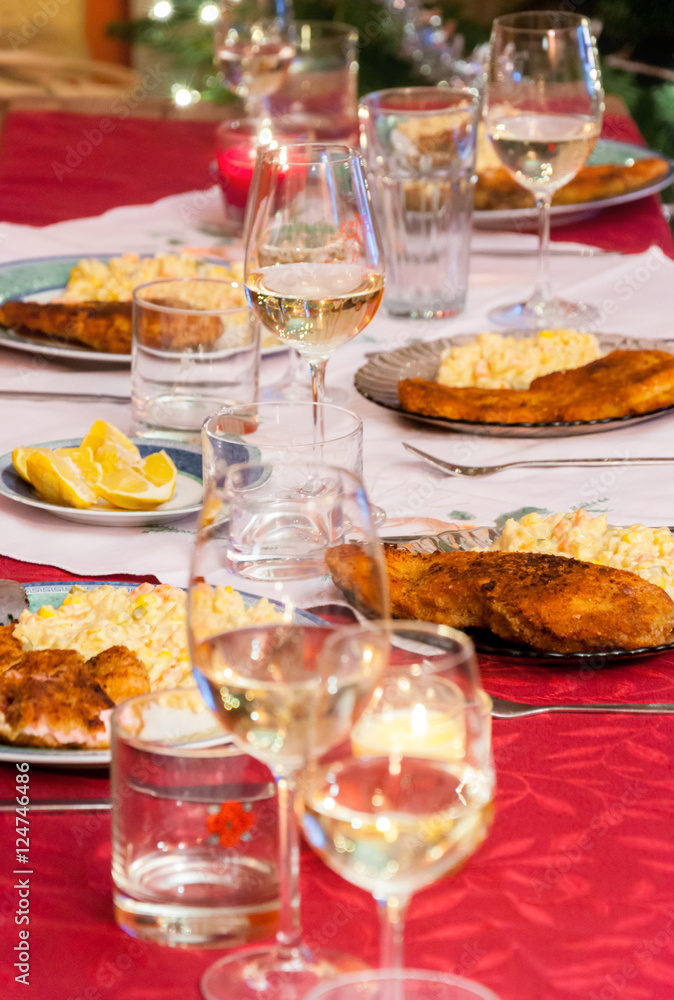 Czech traditional christmas table with fried carp fish and potato salad