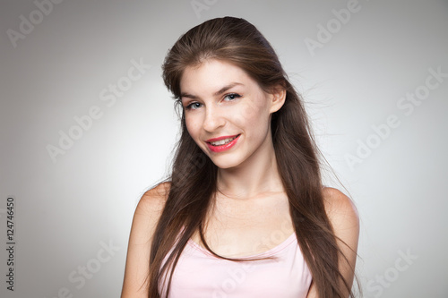 Portrait of smiling girl posing at camera.