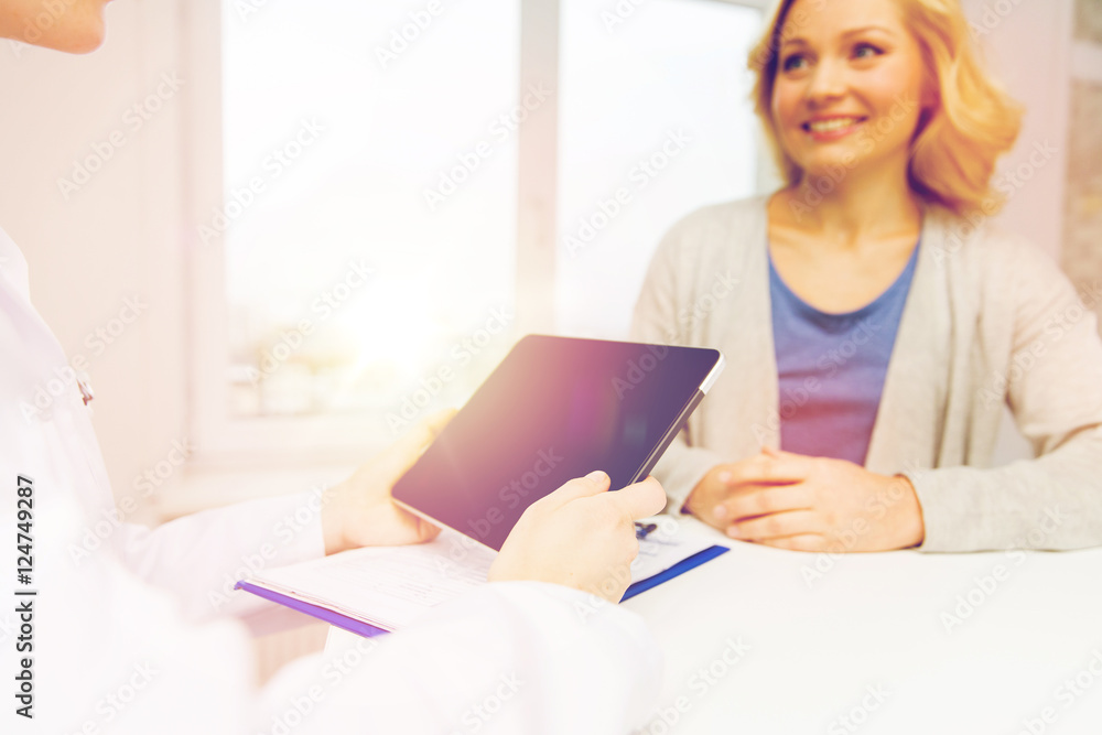doctor with tablet pc and woman at hospital doctor with tablet pc and woman at hospital