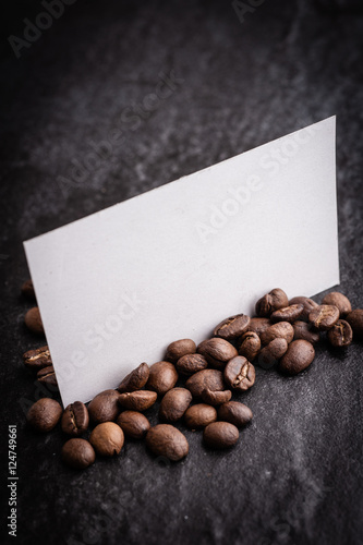 Wallpaper Mural roasted coffee beans with blank paper on dark background, can be used as a background Torontodigital.ca