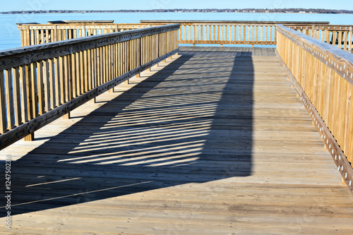 Wharf railing shadow