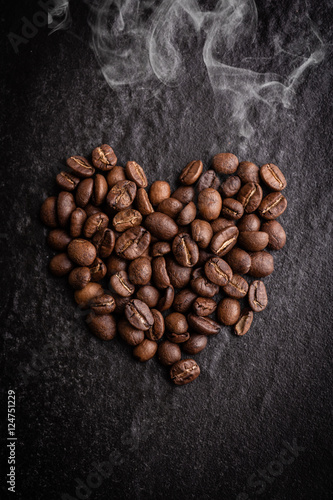 roasted coffee beans on dark background, can be used as a background