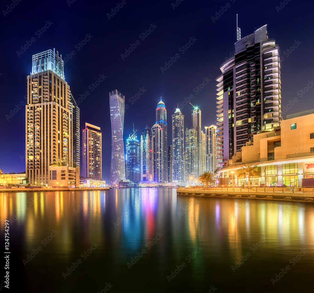 Fototapeta premium Panoramic view of Dubai Marina bay with yacht and cloudy sky, Dubai, UAE