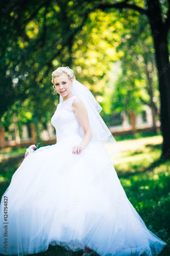 portrait the bride on the background of the park