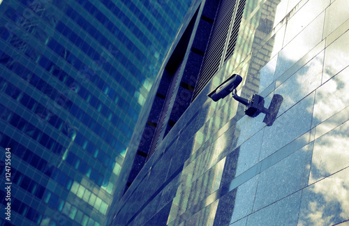 Surveillance video camera on the front of the building photo