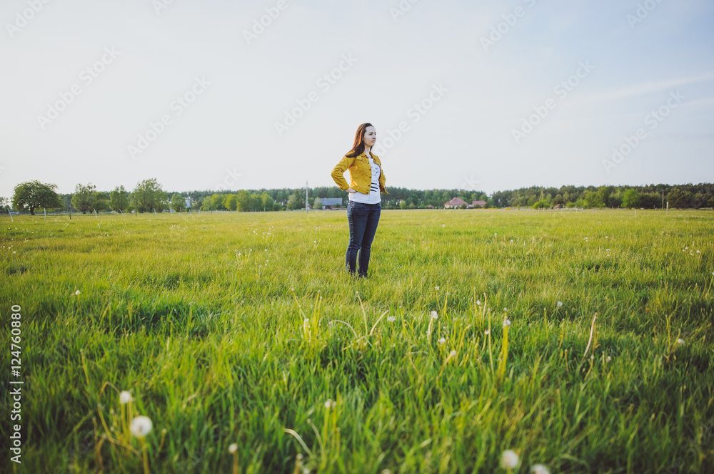 Happy young girl enjoying the beauty of sunny spring day Happy young girl enjoying the beauty of sunny spring day
