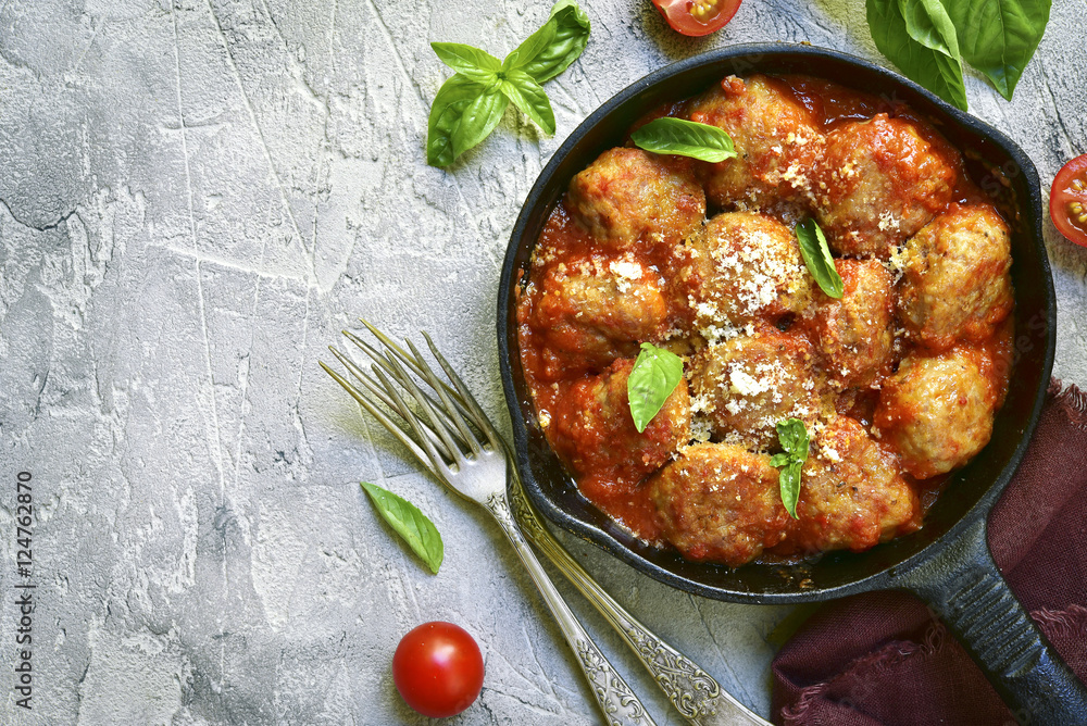 Meatballs in tomato sauce in a skillet.Top view. Meatballs in tomato sauce in a skillet.Top view.