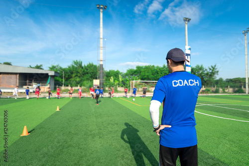Fotótapéta blurred image of Coach is coaching Children Training In Soccer T