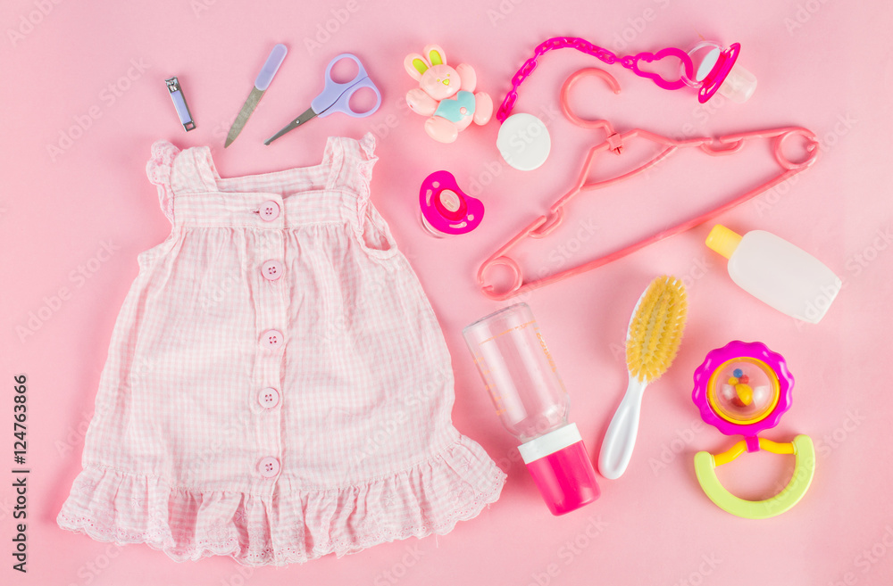 Set for girl baby. On a pink background.Top view. Flat lay.