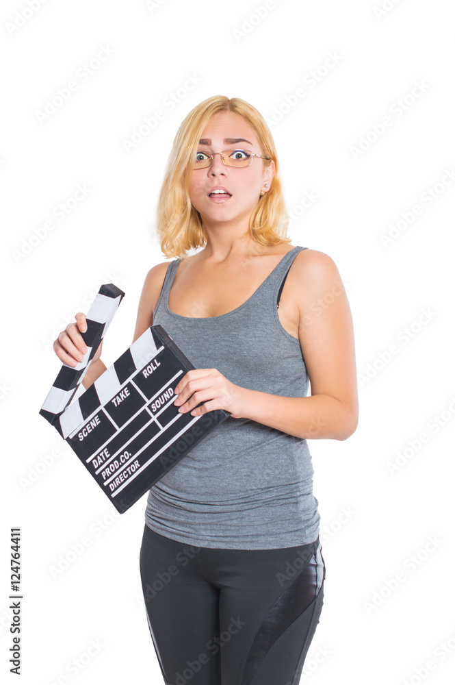 Girl holding clapperboard and posing. On white, isolated background. Girl holding clapperboard and posing. On white, isolated background.