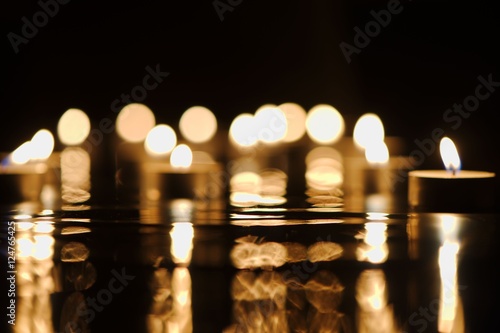 Defocused candlelight with reflection