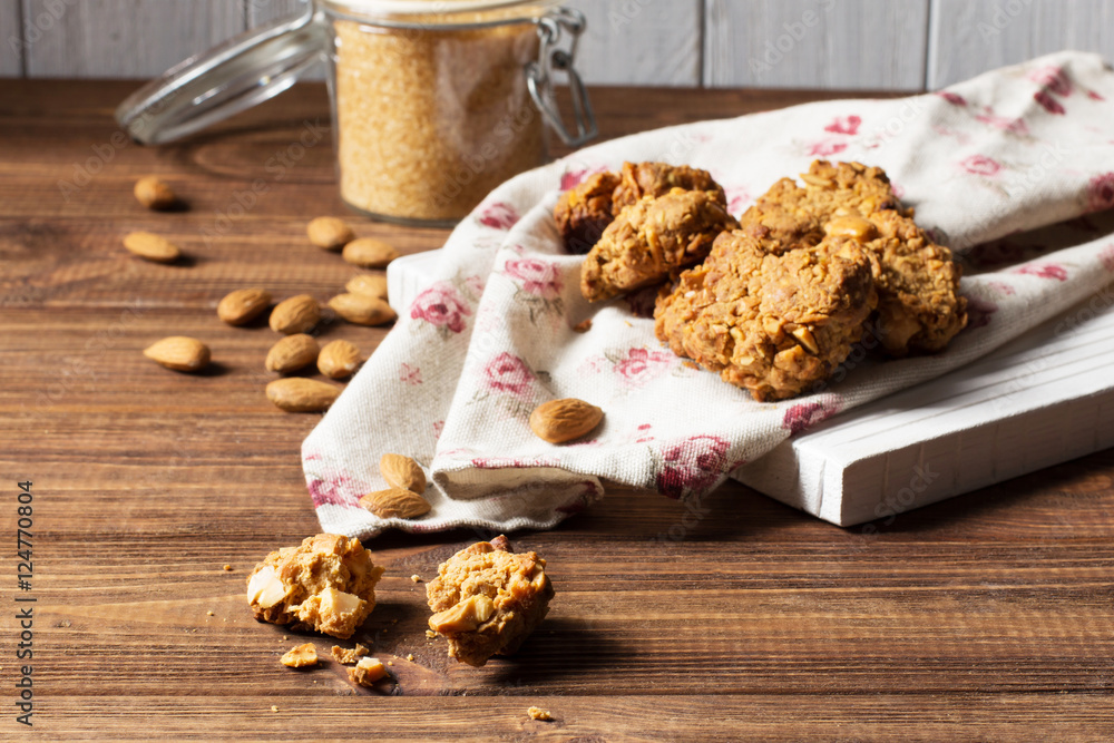 Fototapeta premium Caramel cookies with nuts, selective focus, horizontal