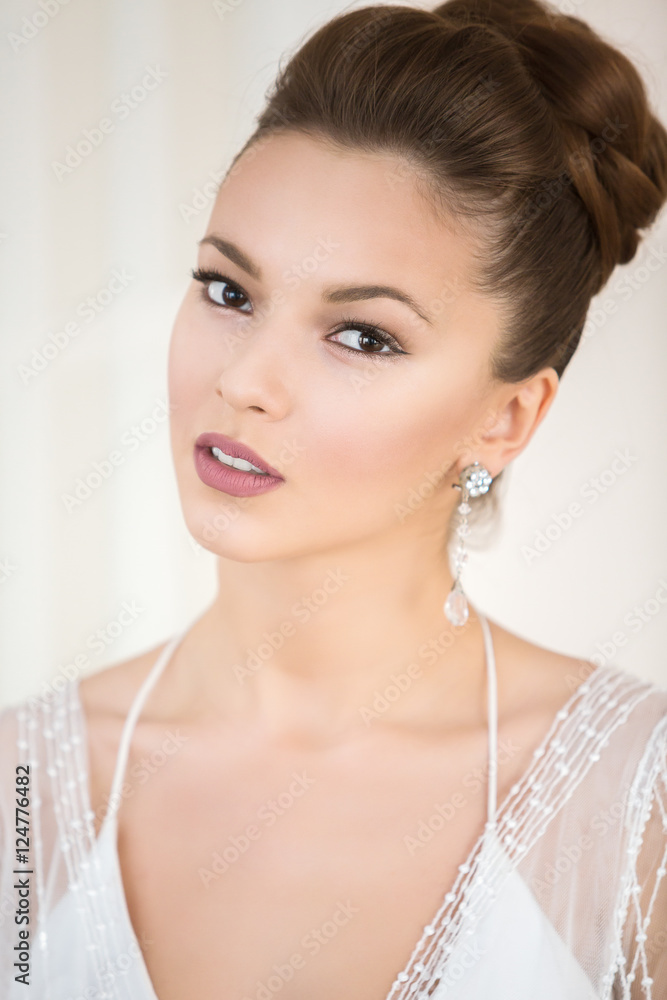Portrait of Young attractive bride in white beautiful wedding dress close up. Wedding concept