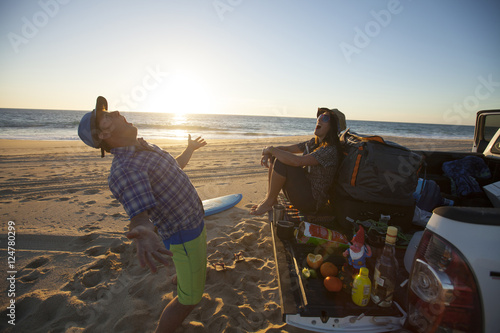 An adult man and woman enjoying a beach tailgater in Todos Santos.  Baja California, Mexico. photo