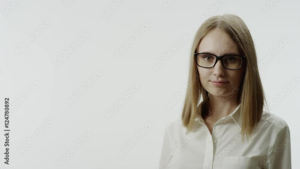 Closeup portrait of smiling woman wearing eyeglasses Closeup portrait of smiling woman wearing eyeglasses
