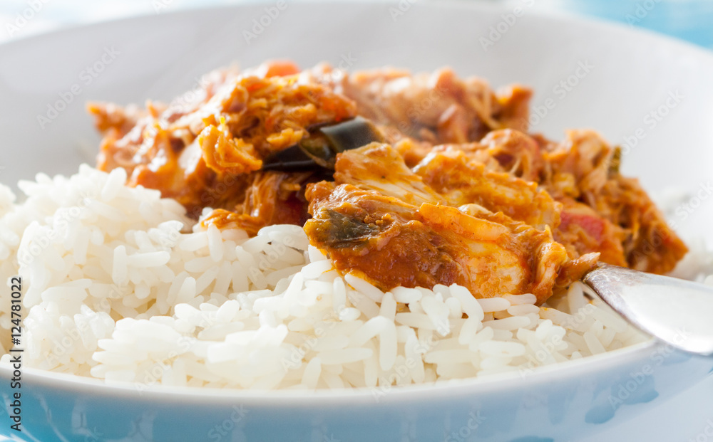 Close-up view of Ghanaian groundnut stew with long grain rice in a white bowl Close-up view of Ghanaian groundnut stew with long grain rice in a white bowl