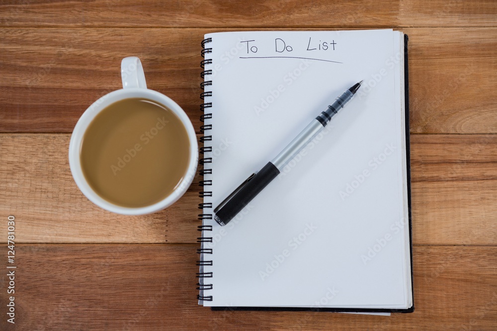 Cup of tea with diary and pen Cup of tea with diary and pen