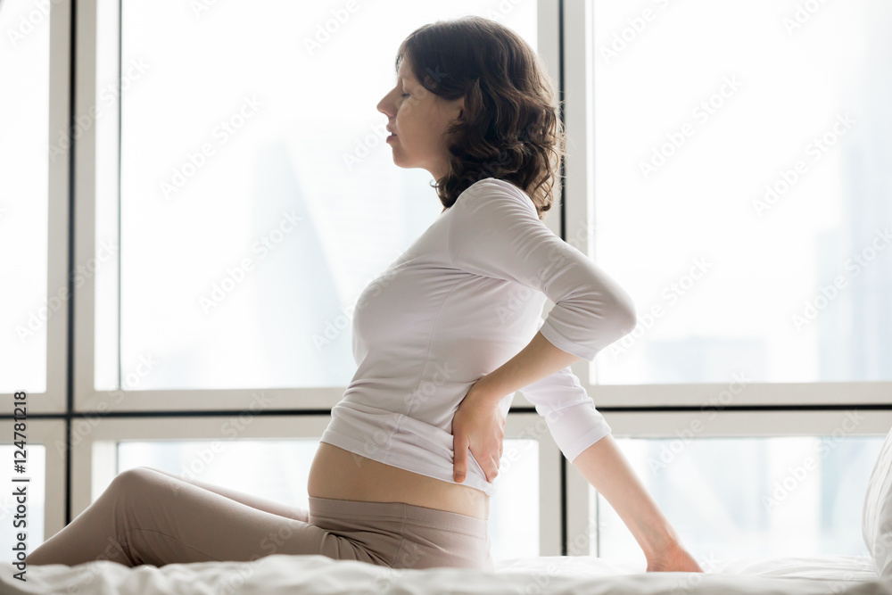 Future mom suffering from spinal pain