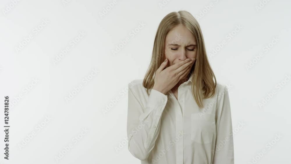 Bored woman yawns om the white background Bored woman yawns om the white background