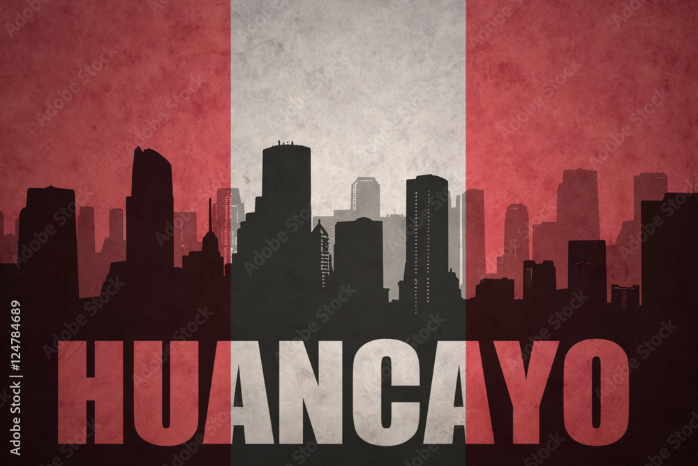 abstract silhouette of the city with text Huancayo at the vintage peruvian flag
