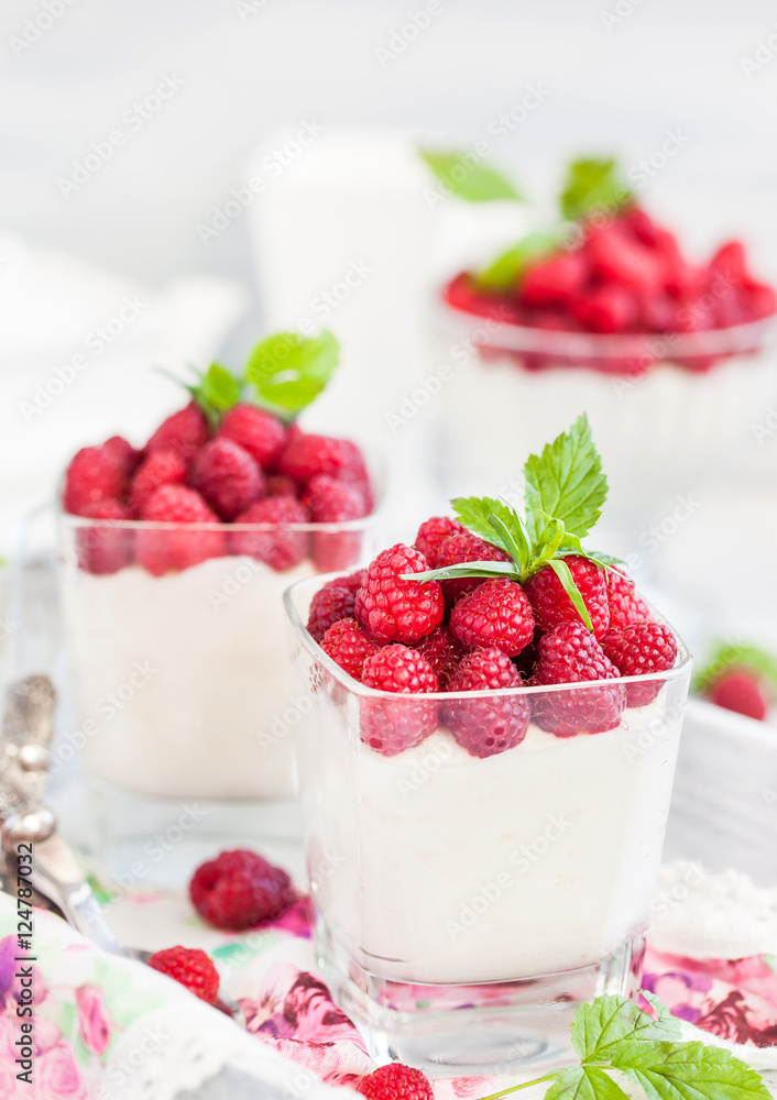 Delicious sweet mousse decorated with fresh raspberries Delicious sweet mousse decorated with fresh raspberries