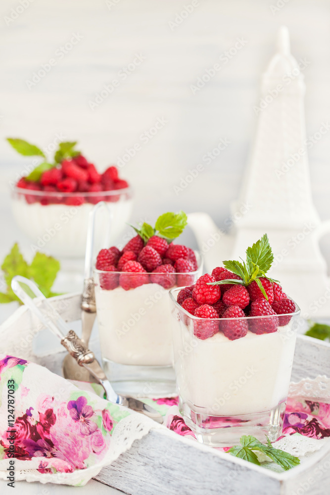 Delicious sweet mousse decorated with fresh raspberries Delicious sweet mousse decorated with fresh raspberries