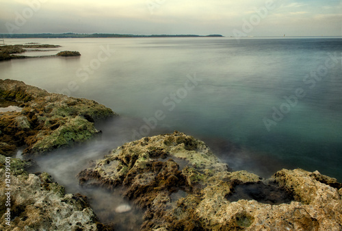 Mediterranean seaside with rocks in the morning, long time exposure © Andrzej