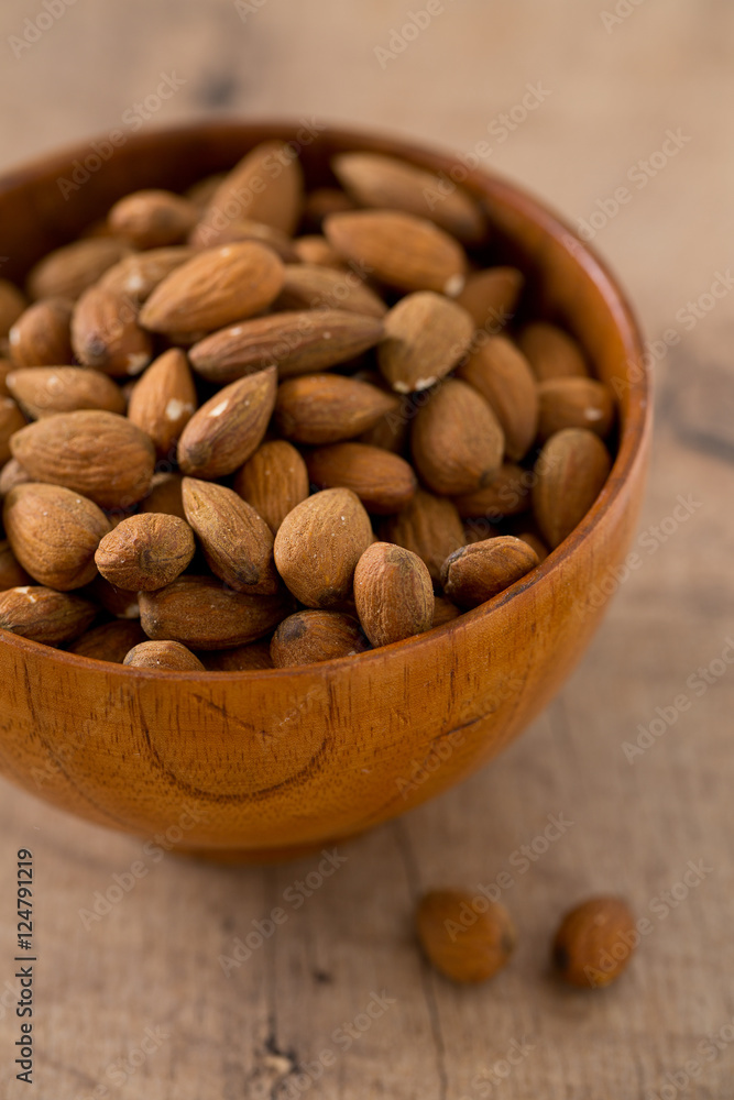 almonds on wooden surface almonds on wooden surface