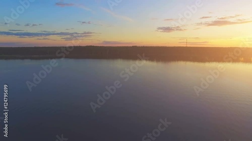 Wallpaper Mural Aerial Drone Flight Footage: Flight above calm Water and forest in sunset soft light. Magestic landscape. Colorful nature background. Kiev Sea, Ukraine, Europe. 4K resolution. Torontodigital.ca