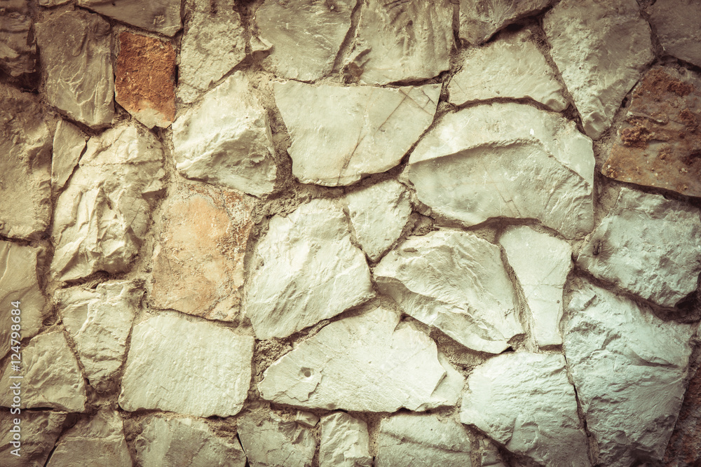 Obraz premium Texture old rock wall made of random stone