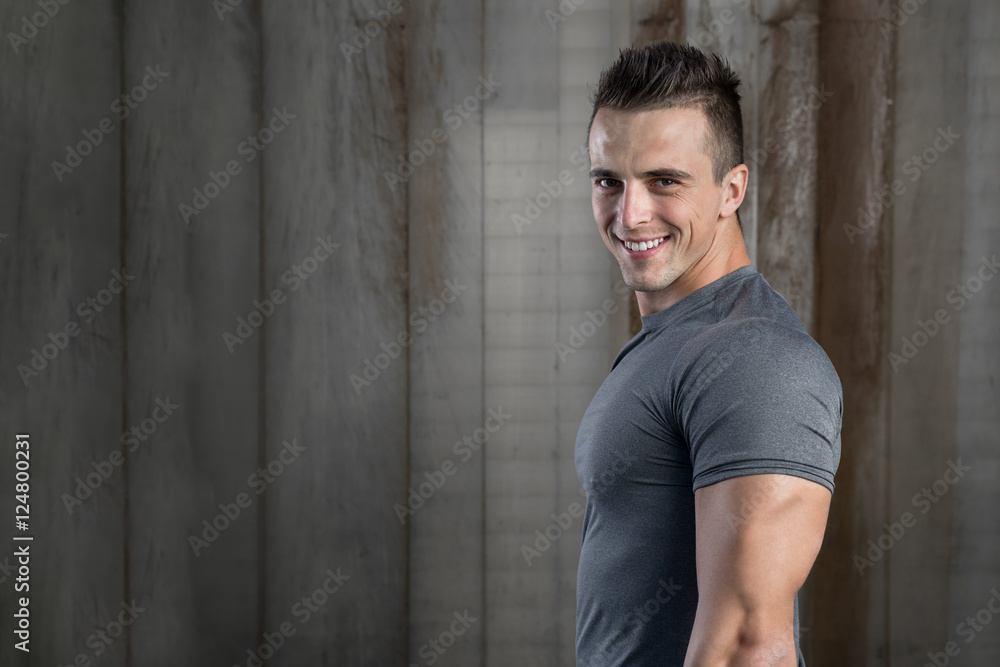 Portrait of strong and sporty young man after fitness exercise o Portrait of strong and sporty young man after fitness exercise o