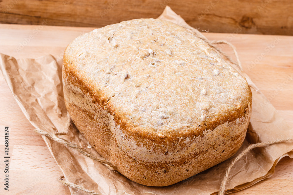 loaf of bread on backing paper loaf of bread on backing paper