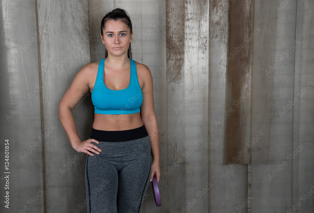 attractive fitness woman against rustic background, trained fema attractive fitness woman against rustic background, trained fema