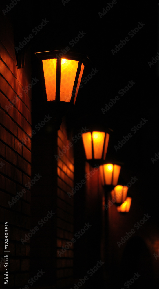  Vintage retro lanterns on a brick wall