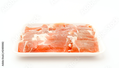 Slide of raw pork on white background .