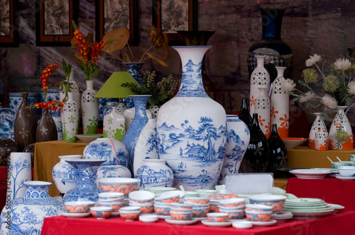Common traditional pottery products on a shop in Bat Trang ancient ceramic village. Bat Trang village is the oldest and best known pottery village of Vietnam.